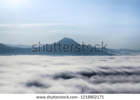 Scenic landscape view in sunset Mist wave around mountain in morning and beautiful wave clear blue sky at popular nature landmark "Phu tok" ,Chiang khan, Loei, Thailand.