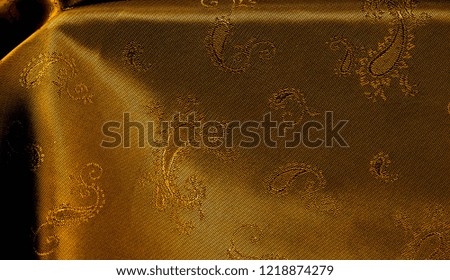 Texture background pattern Yellow mustard brown chiffon fabric with paisley print High quality pure silk chiffon fabric bright beautiful color combinations This fabric is suitable for design wallpaper
