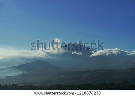 Scenic View Of Landscape of volcano with mountain and mist, from Indonesia           