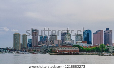 View of harbor and buildings of downtown Boston by water, in Boston, USA