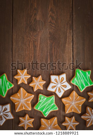 Christmas homemade gingerbread house cookie over wooden background. Sweets as a gift for the new year. free space free space greetings