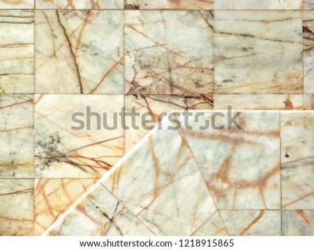 The arrangement of marble tiles floor in different level floor design on vintage style, top view with copy space 