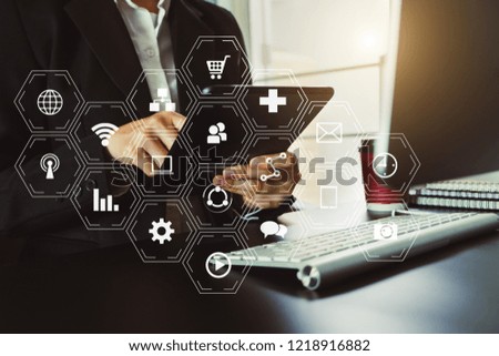  Businessman working with smart phone and laptop and digital tablet computer in  office with digital marketing media  in virtual icon
