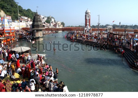 Hindu devotees take a dip in the water of the Ganges at Har Ki Pauri in Haridwar, India.  The place is considered very auspicious.
 Royalty-Free Stock Photo #1218978877