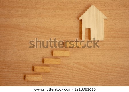 Wood house with stair,success stair step.Goals concept. 