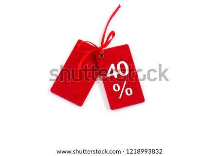 Discounted sales tags or labels isolated on white background. Copy space. Close-up.