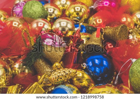 Christmas vibrant colorful wallpaper background texture of balls and decorations for the celebration tree.