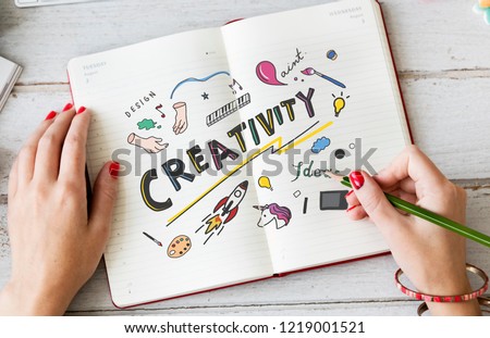 Young woman drawing creativity in a notebook