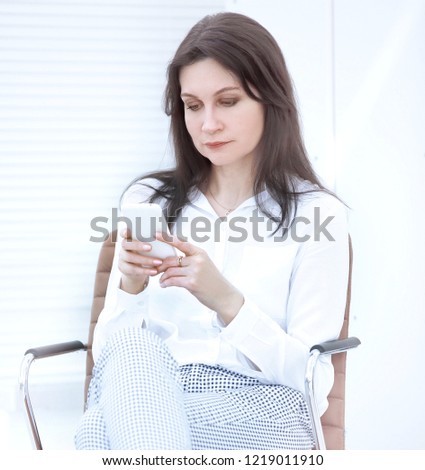 closeup.modern business woman reading SMS on smartphone. people and technology