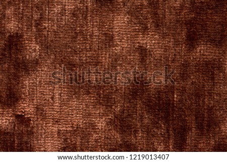 Contrast textile background in velvet brown tone. High resolution photo.