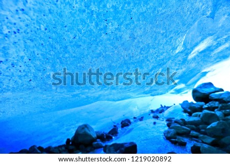 View from the beautiful ice cave under the glacier at the Vatnajokull National Park in Iceland in winter.