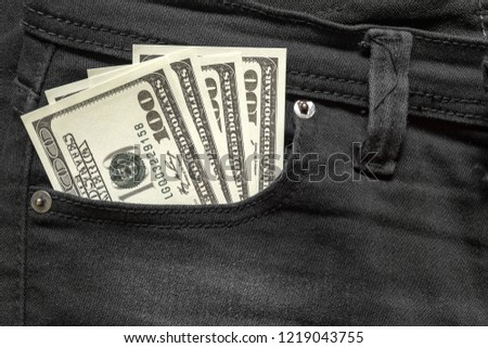 Dollar money in the  pocket of jeans. Banknote One hundred dollar. The concept of finance. Close-up. Copy space. for your background.