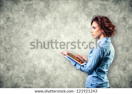 Photo of the girl with a computer in a hand