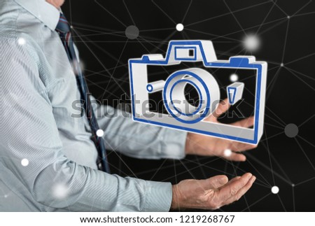 Pictures sharing concept above the hands of a man