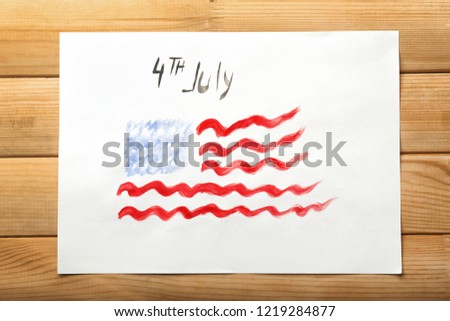 Watercolor painting of American national flag on wooden table. 4th July celebration