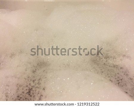 Soap bubbles and Foam bath in bathtub water close up 