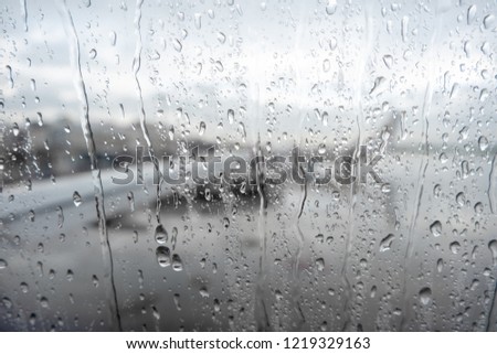 airplane window during rain 