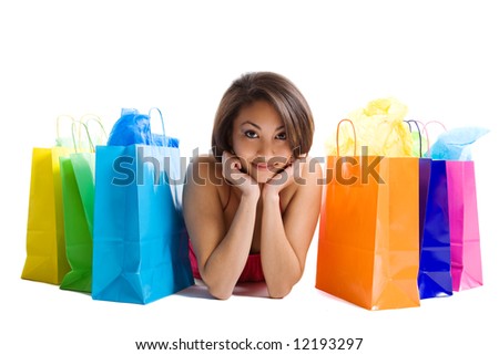 An isolated shot of a black woman with shopping bags