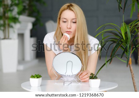 Woman Cleaning Face With White Pad. Beautiful Girl Removing Makeup White Cosmetic Cotton Pad. Happy Smiling Female Taking Off Makeup From Facial Skin With Cosmetic Pad. Face Skin Care. Home interior
 Royalty-Free Stock Photo #1219368670