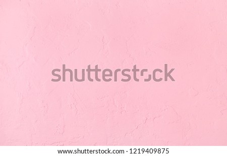 Cloth textured plastered pink background Royalty-Free Stock Photo #1219409875