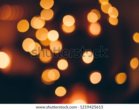 image of blurred bokeh background with warm colorful lights, vintage tone