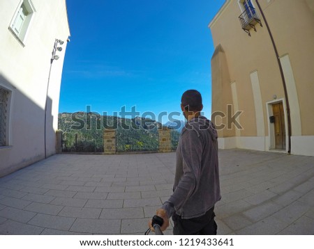 Man in a small square in Nuoro. Sardinia, Italy