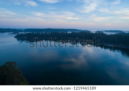 Beautiful sunset in Stendorren, Nykoping, Sweden, Scandinavia. Lovely nature and landscape on autumn evening. Nice outdoors photo shot with drone in sky from above. Calm, peaceful, and joyful.