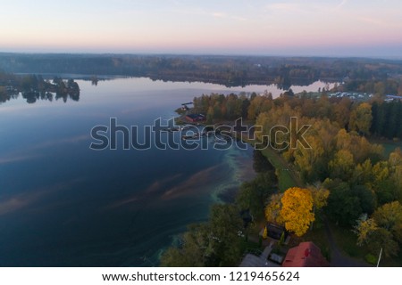 Beautiful sunset in Katrineholm, Sweden, Scandinavia. Lovely nature and landscape on autumn evening. Nice outdoors photo shot with drone in sky from above. Calm, peaceful, stillness and joyful.