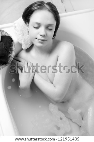 beautiful girl relaxing in the bath.toned picture