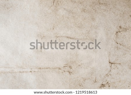 Old vintage paper texture background. High-quality photo texture of old vintage paper with scuffs, cracks and drops of spilled coffee.