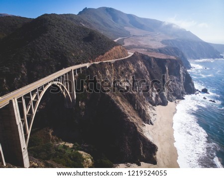 Aerial panoramic view of historic Bixby Creek Bridge along world famous Pacific Coast Highway 1 in summer sunny day , Monterey County, California, USA, shot from drone
