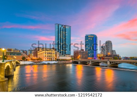 Grand Rapids, Michigan, USA downtown skyline on the Grand River at dusk. Royalty-Free Stock Photo #1219542172