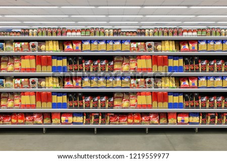 Pasta packing on a shelf in a supermarket. is suitable for presenting new packaging among many others. Royalty-Free Stock Photo #1219559977