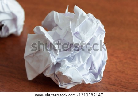 Crumpled paper balls on the table.