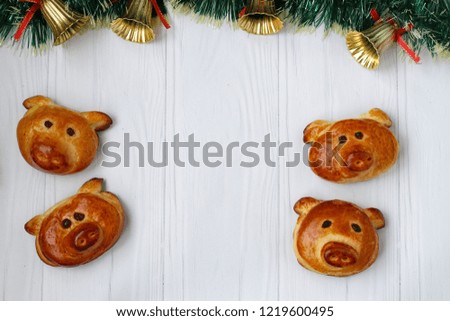 Buns "Piglets" for the New Year 2019. Homemade baking. Buns on a white background Copy space Top view
