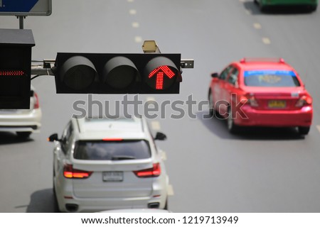 Traffic lights with a red light camera, traffic enforcement camera that captures an image of a vehicle that breaking traffic laws. the photographic evidence and determine whether a violation occurred.