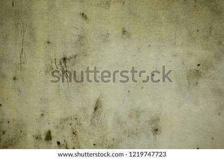 old dirty white wall with deep scratches and stains of dirt and mold. rough texture. rough concrete wall