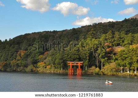 Landscape picture of lake and mountain with the red wooden shine for luck. Lake Ashinoko