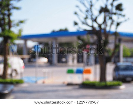 blur image of car parking in gas station