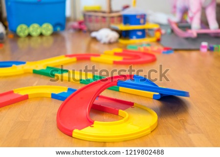 Multi-colored toy road for cars in the game room.