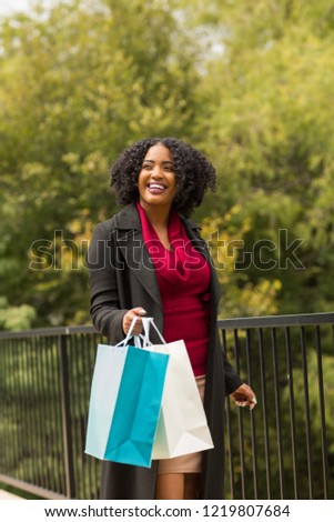 Woman shopping and laughing.