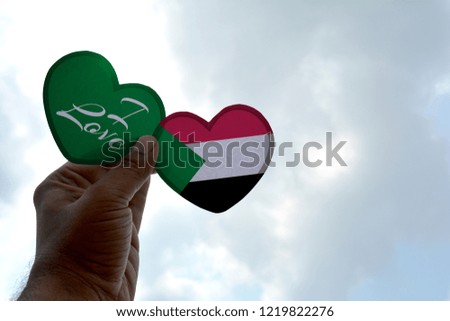 I love Sudan, Hand holds a heart Shape flag