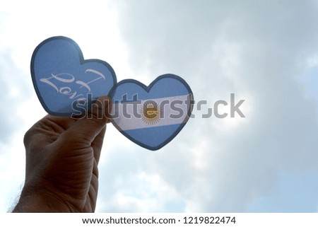 I love Argentina, Hand holds a heart Shape flag