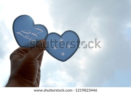I love Micronesia, Hand holds a heart Shape flag