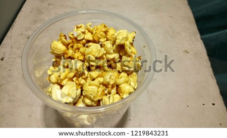 Pop corn In plastic glass.