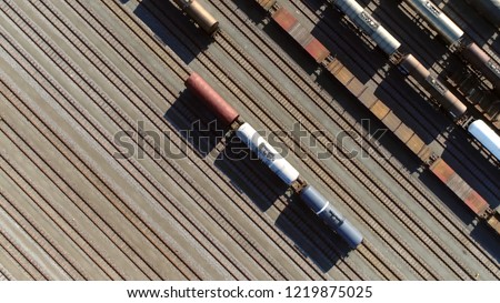 Aerial top down picture of classification yard with goods wagons on the railroad gathering found at some freight train stations used to separate rail cars onto one of several tracks