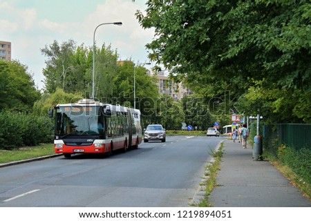 Articulated low-floor bus in Prague in summer day, "Jižní Město" means "South City"