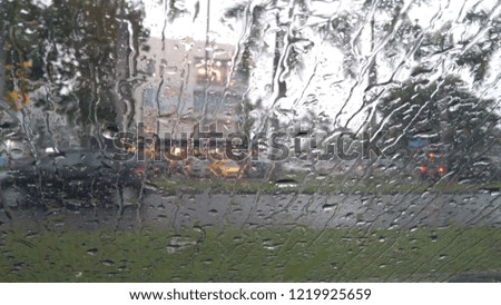 Raindrops on windshield, abstract background, center focusing