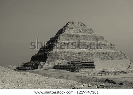 The black and white stepped pyramid of Djoser in Saqqara , Egypt.