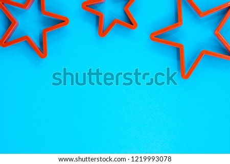 Cookie cutter star shape on blue background